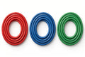 Three coiled resistance band loops in red, blue and green on white background
