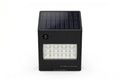 Square black solar-powered LED wall light with solar panel, motion sensor and LED array on white background