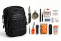 Black 47-piece emergency survival kit pouch with knife, compass, whistle, flashlight and first aid supplies on white background